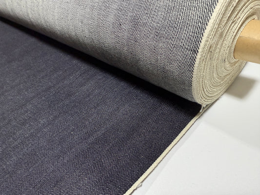 Okayama Denim roll showcasing 12.5 oz indigo Japanese selvage denim fabric by yard for versatile apparel projects.