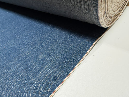 Okayama Denim | 12.5 oz Japanese Indigo Slub Denim fabric rolled by the yard showcasing natural texture.