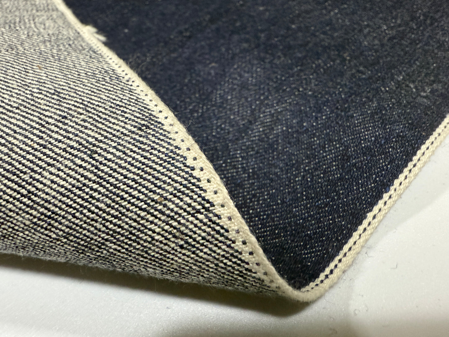 Okayama Denim 13 oz Japanese Indigo Kibata Selvage Denim showcasing premium fabric texture and selvedge detail.