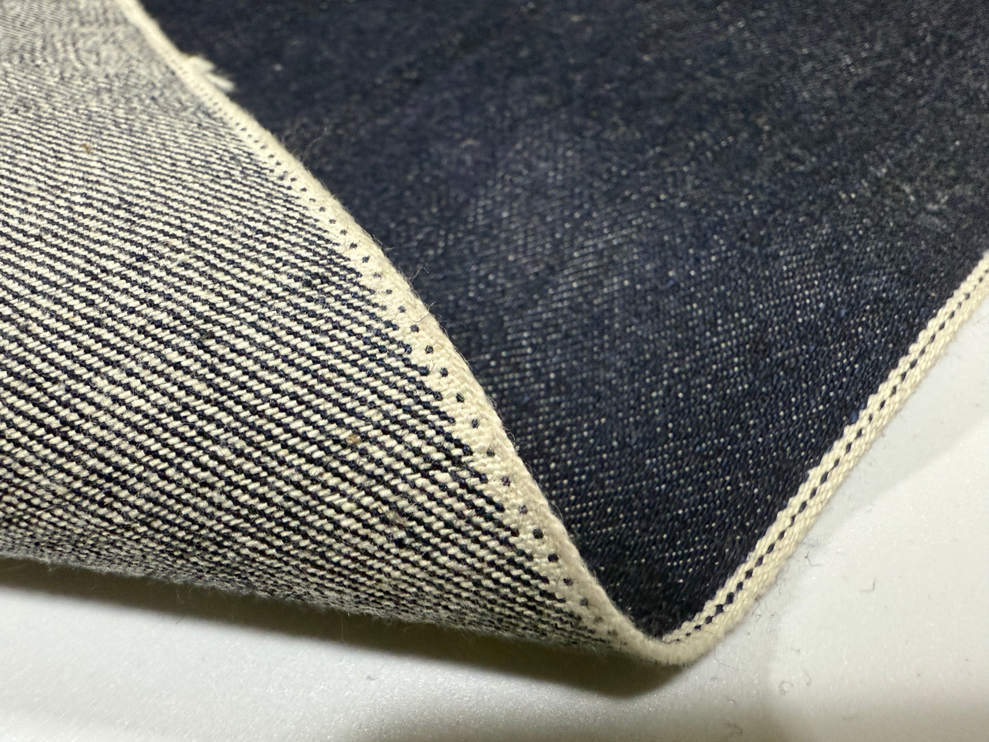 Okayama Denim 13 oz Japanese Indigo Kibata Selvage Denim showcasing premium fabric texture and selvedge detail.