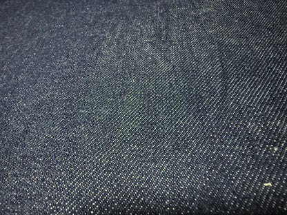 Okayama Denim | 13 oz Japanese Indigo Kibata Selvage Denim fabric close-up showing texture and color.