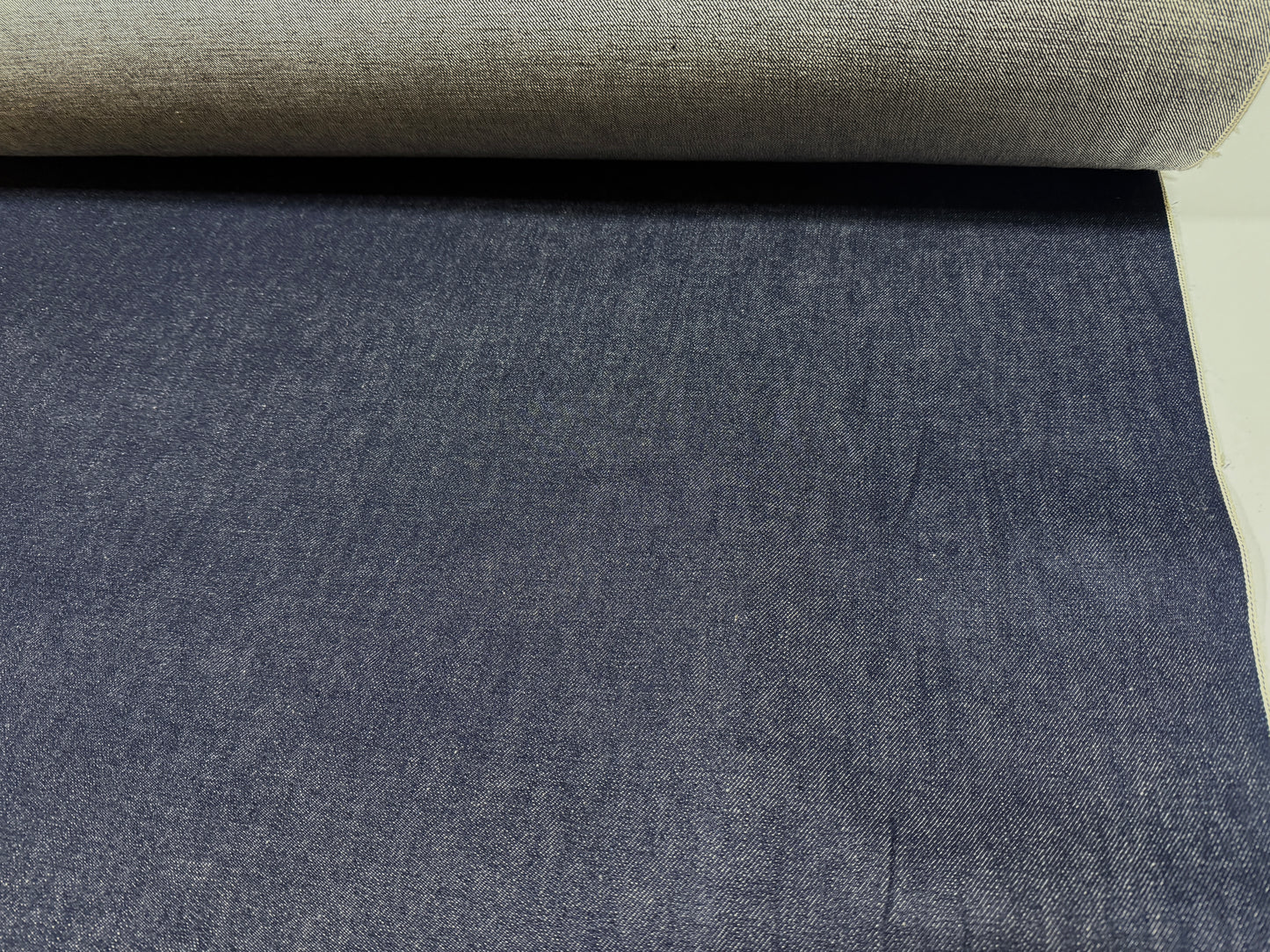 Okayama Denim 13 oz Japanese Indigo Kibata Selvage Denim fabric showing rich dark blue texture.