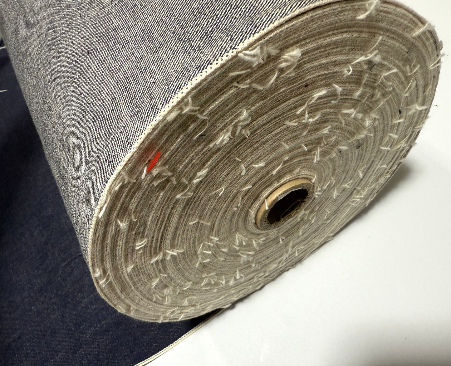 Okayama Denim | 13 oz Japanese Indigo Kibata Selvage Denim roll showcasing premium fabric texture.