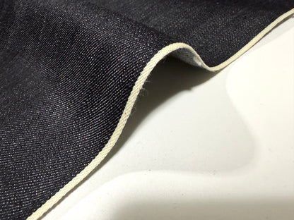 Okayama Denim 12.5 oz indigo Japanese selvage denim fabric showcasing white selvage edge.