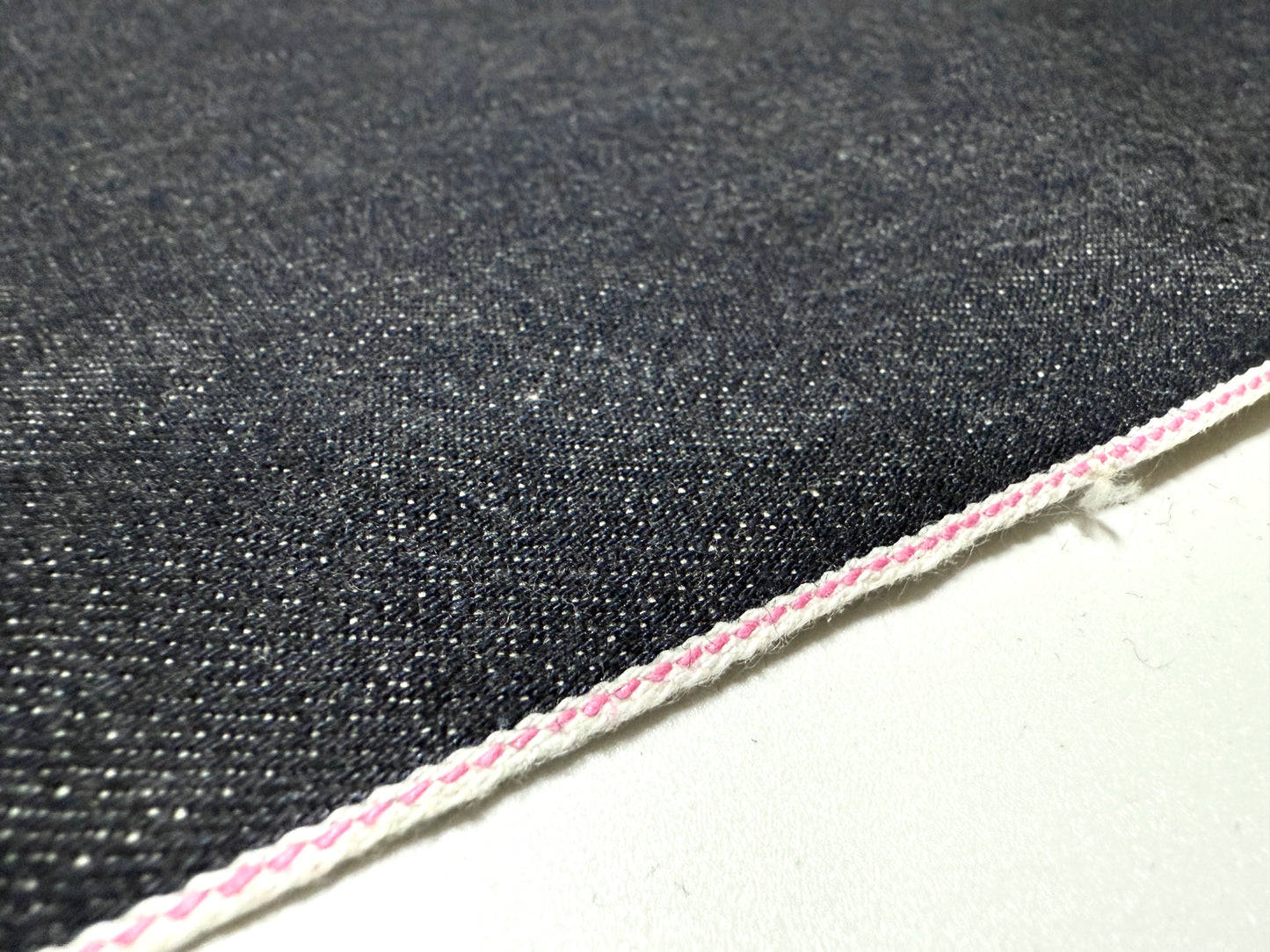Okayama Denim 13.5oz indigo kibata Japanese selvage fabric yard with pink selvage detail.
