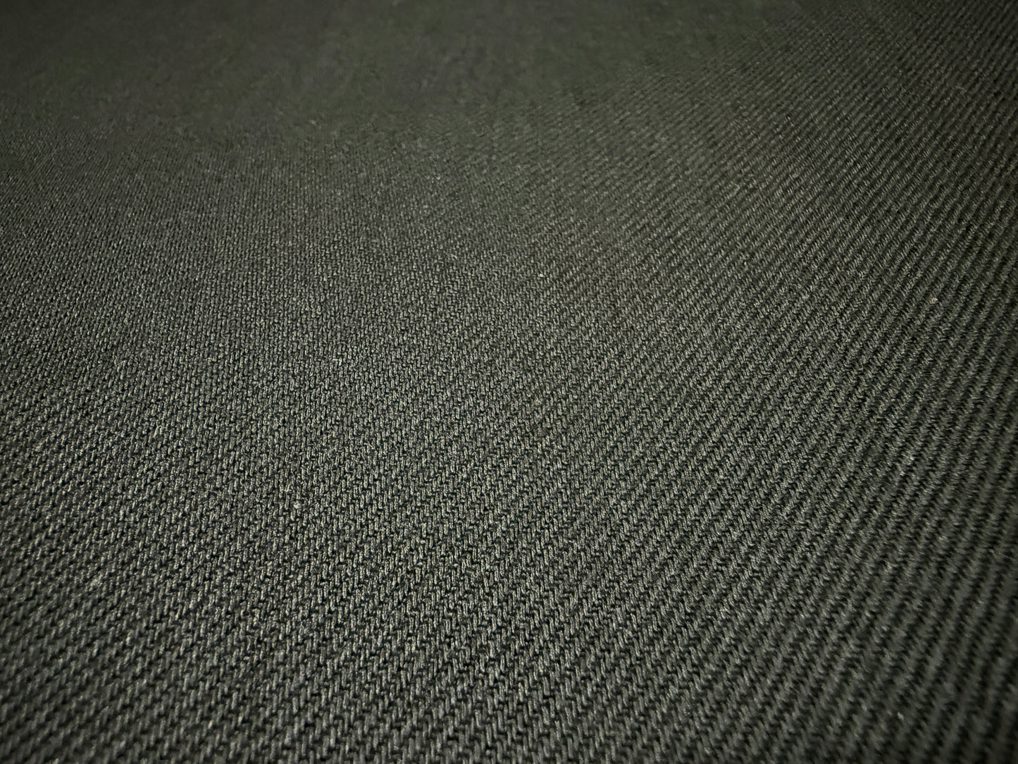 Okayama Denim fabric texture, showcasing the 13.3 oz double-width double-sided black denim in a detailed close-up.