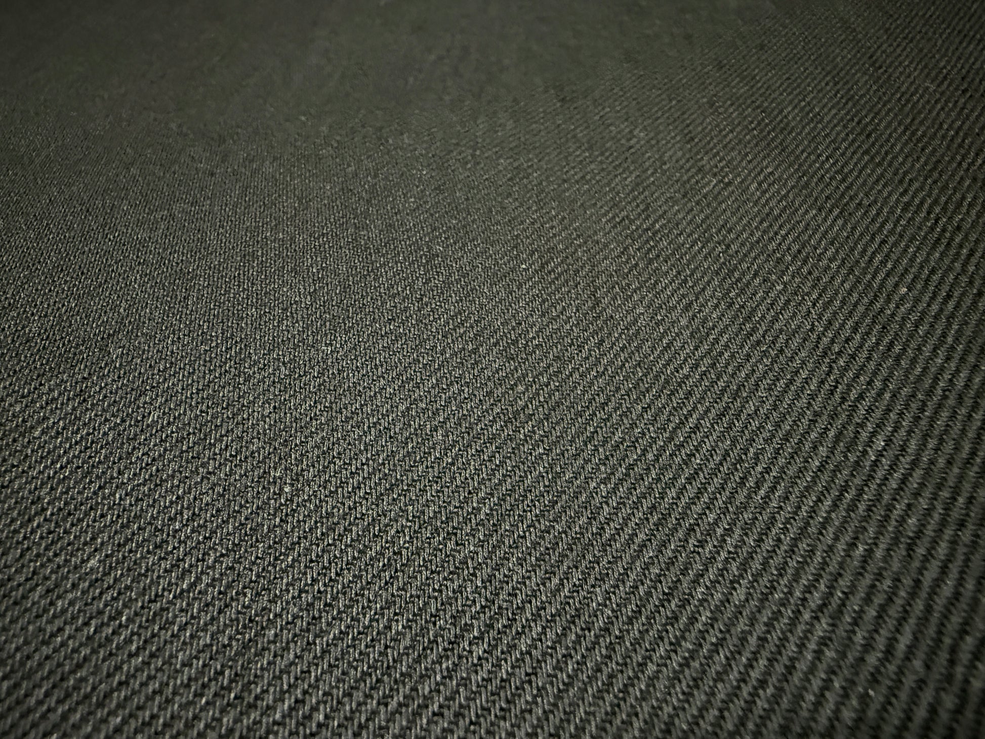 Okayama Denim fabric texture, showcasing the 13.3 oz double-width double-sided black denim in a detailed close-up.