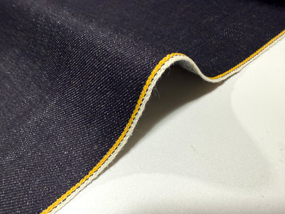 Okayama Denim 13 oz Indigo Kibata Japanese selvage denim fabric with yellow selvage detail, showcasing premium quality.