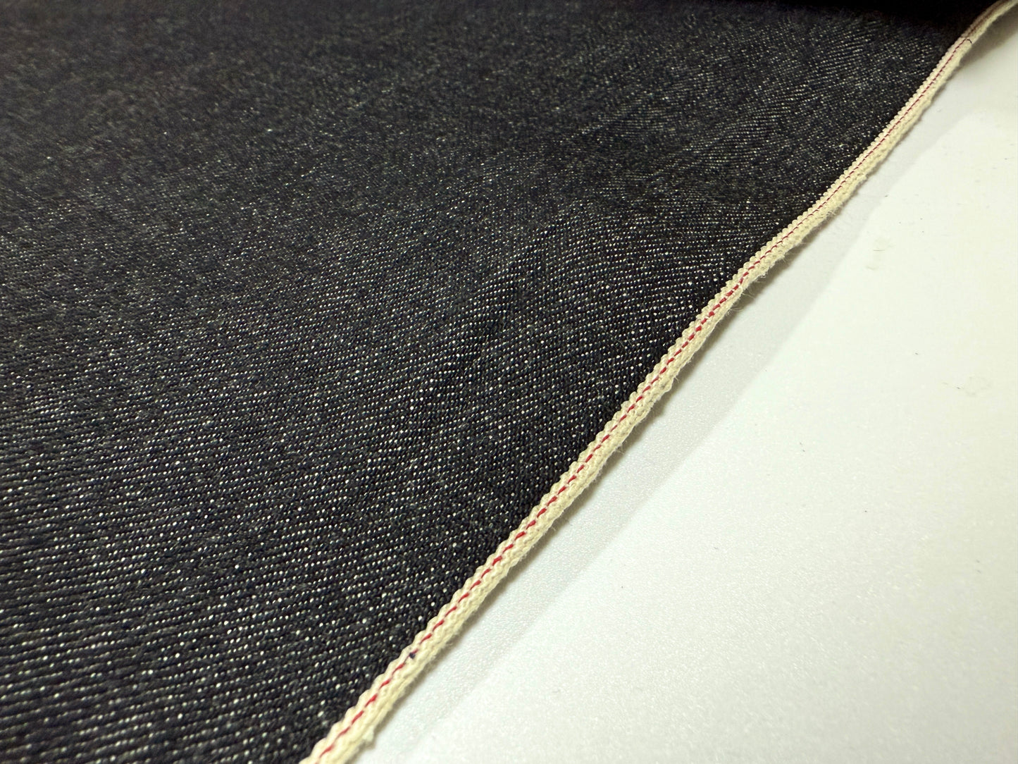 Okayama Denim 16.5 oz Japanese Heavy Ounce Indigo Selvage denim showcasing the selvedge edge and texture.