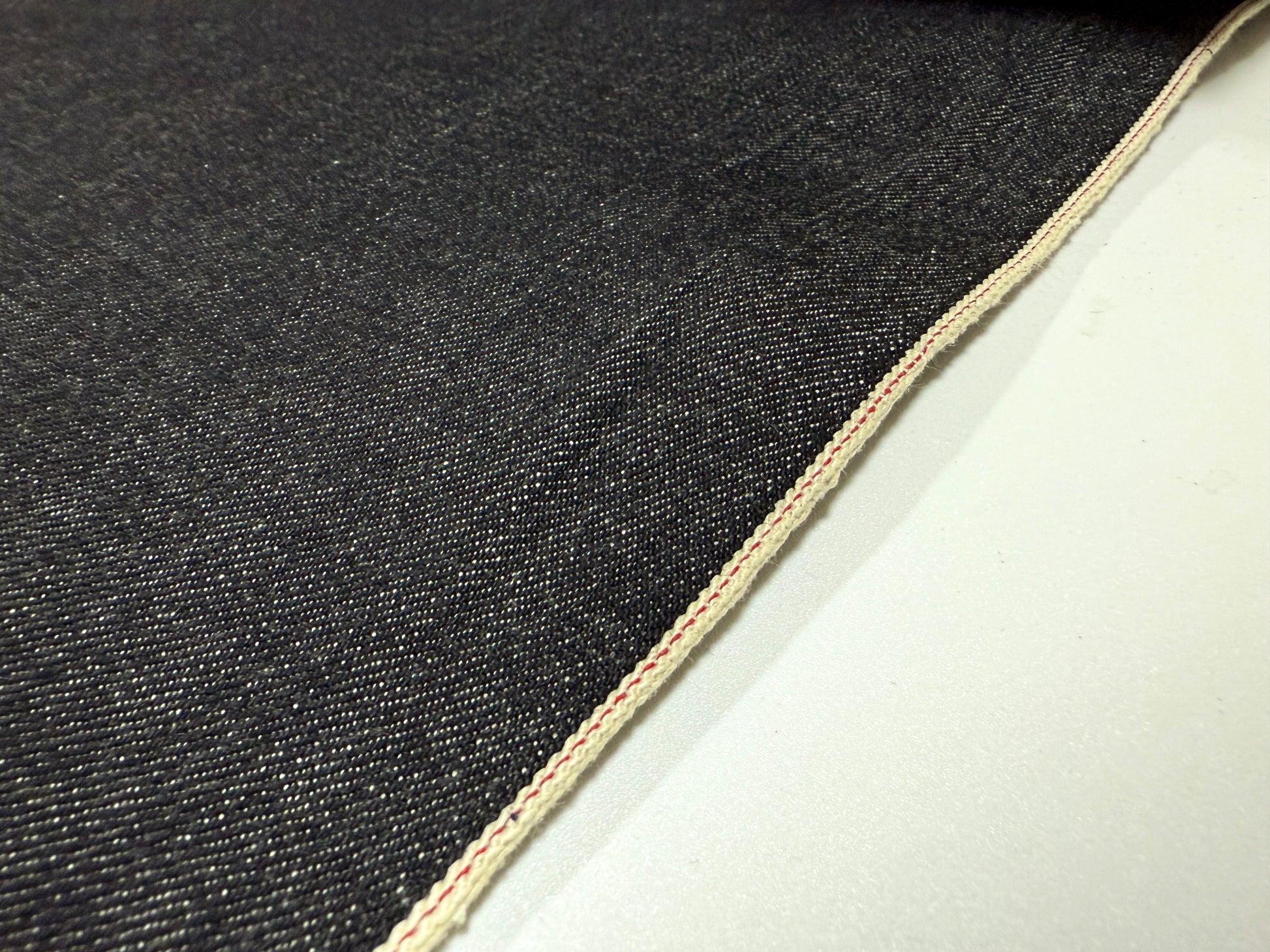 Okayama Denim 16.5 oz Japanese Heavy Ounce Indigo Selvage denim showcasing the selvedge edge and texture.