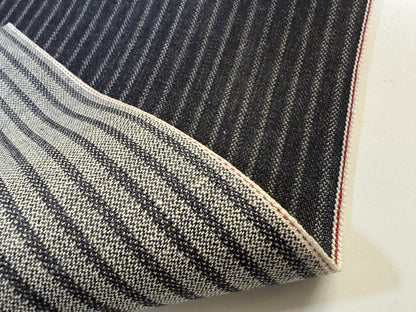 Okayama Denim 11.3 oz Black Selvedge Hickory with striped pattern and raw edge detail