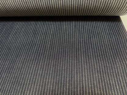 Okayama Denim black hickory selvage fabric roll showing fine stripes and smooth texture.