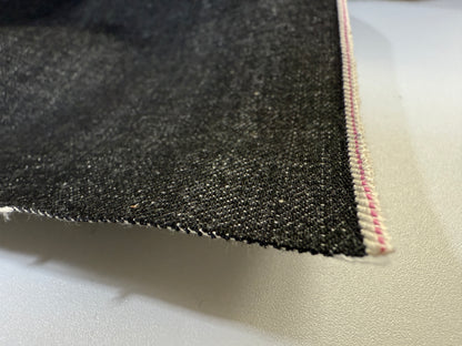 Okayama Denim fabric showcasing 14.6oz black selvage with unique selvedge edge detail.