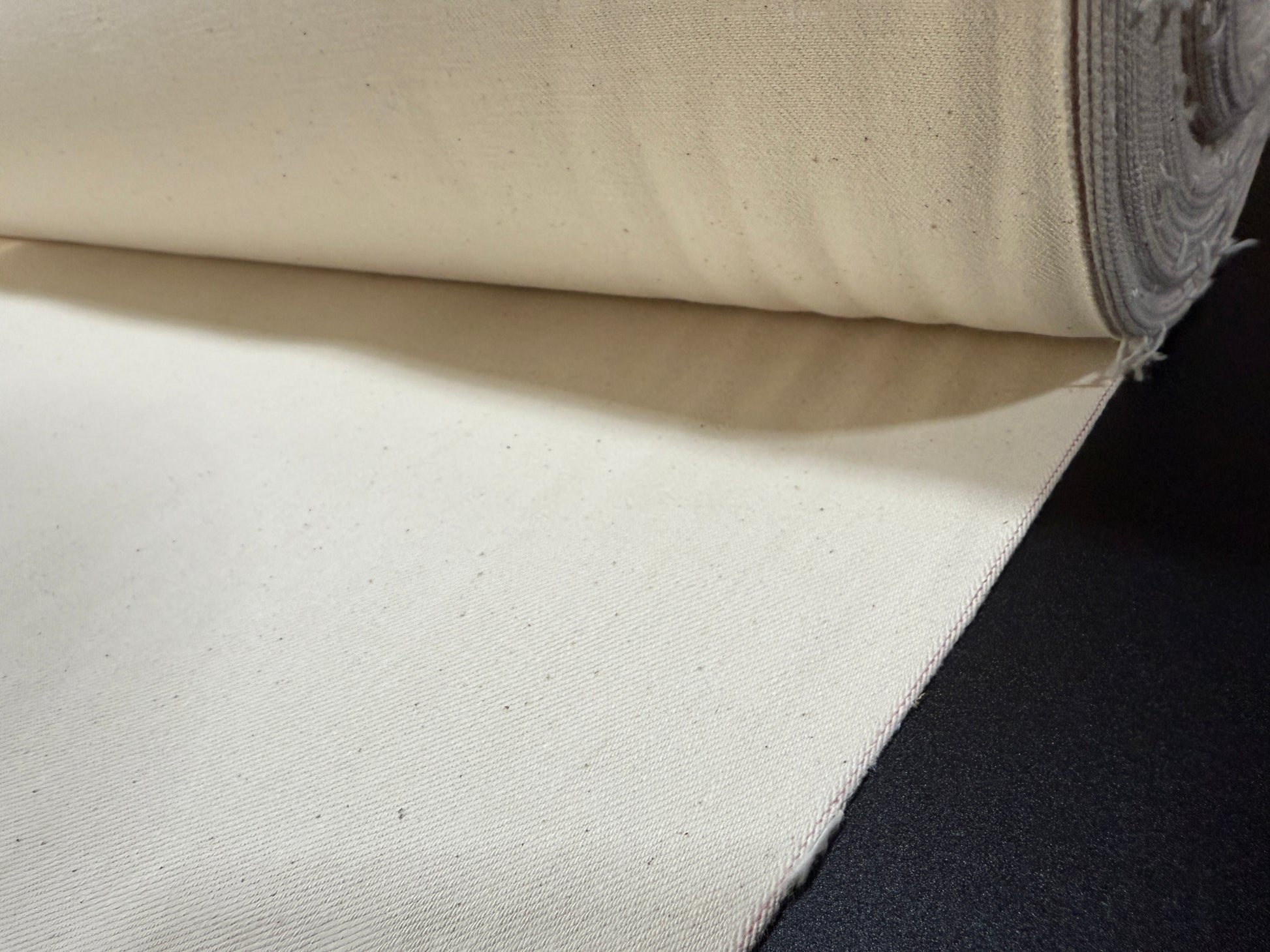 Okayama Denim 13 oz Ecru Selvage fabric showing soft and durable texture suitable for clothing.