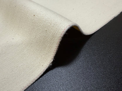 Okayama Denim fabric showing ecru selvage texture and craftsmanship from Japan, perfect for apparel making.