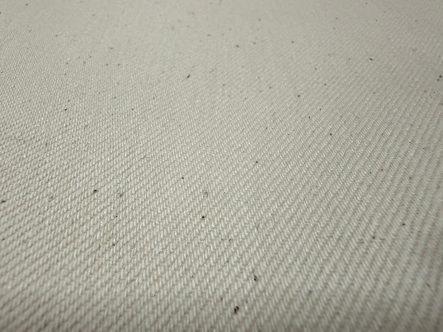 Okayama Denim 13 oz Ecru Selvage fabric showcasing its soft and durable texture, perfect for various clothing items.