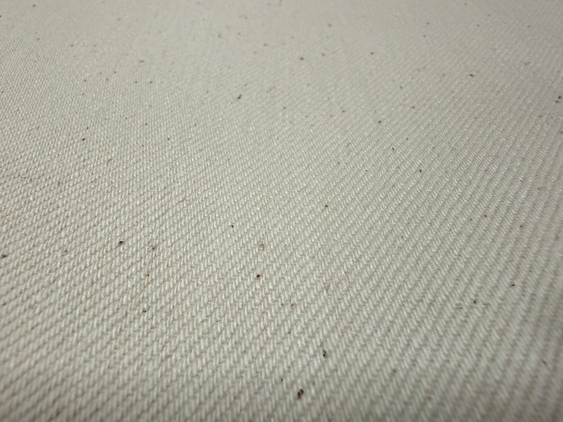 Okayama Denim 13 oz Ecru Selvage fabric showcasing its soft and durable texture, perfect for various clothing items.