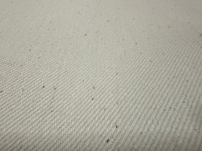 Okayama Denim 13 oz Ecru Selvage fabric showcasing its soft and durable texture, perfect for various clothing items.