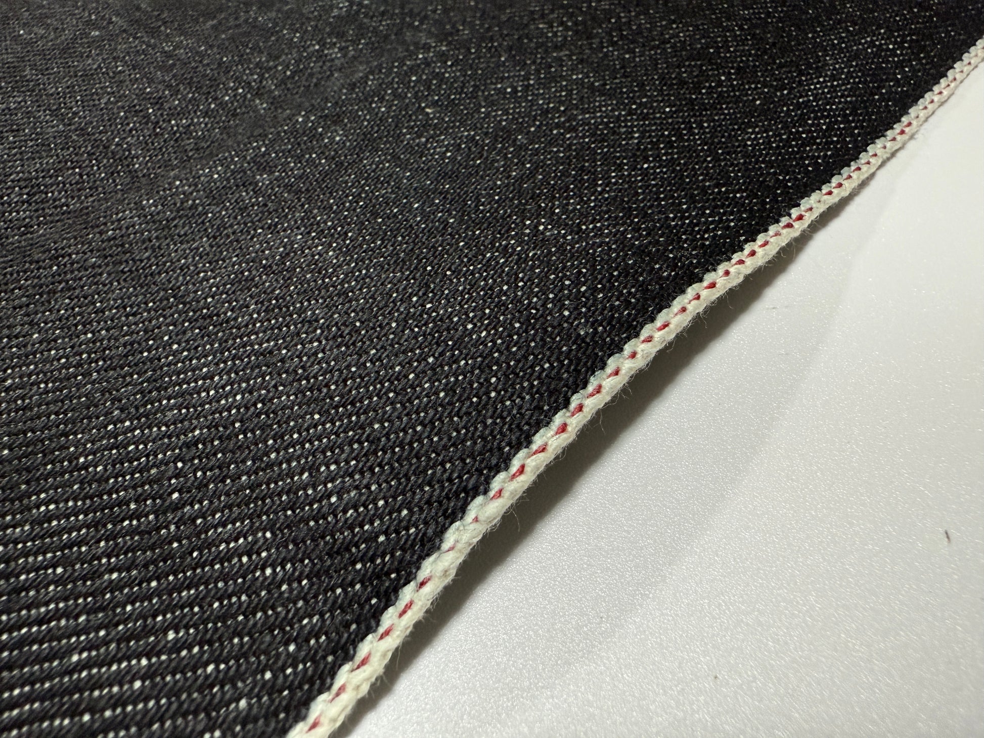 Okayama Denim 20 oz Japanese Heavy Ounce Indigo Selvage denim fabric showing selvage edge detail.