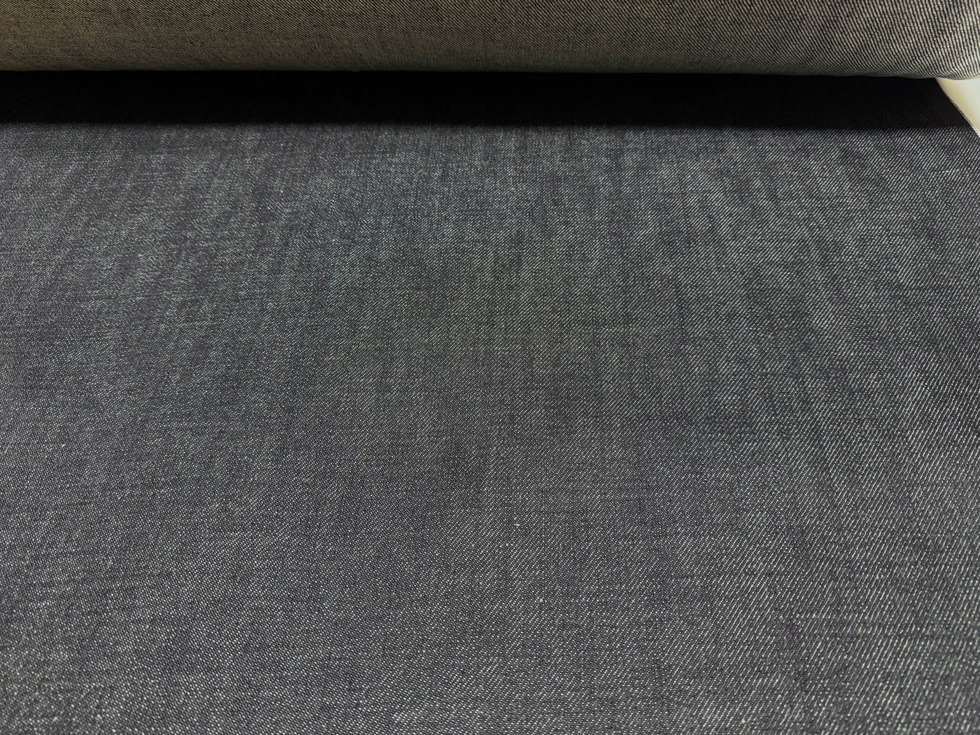 Okayama Denim 20 oz Japanese heavy ounce indigo selvage denim fabric showcasing rich texture and depth.