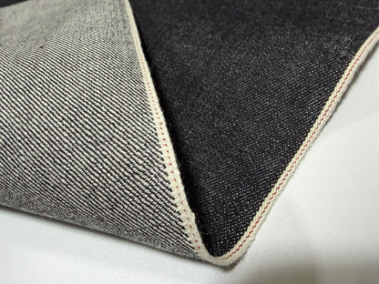 Okayama Denim 14.5 oz Japanese cotton black selvage denim fabric showcasing its smooth texture and quality craftsmanship.