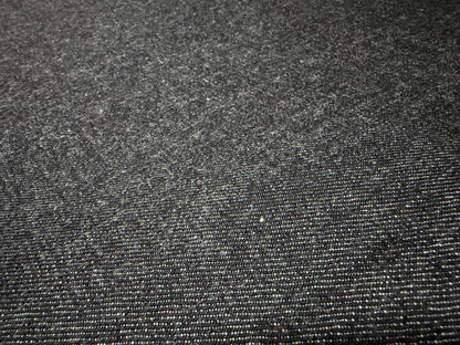 Close-up of Okayama Denim 14.5oz Japanese cotton black selvage denim fabric showcasing texture and quality.