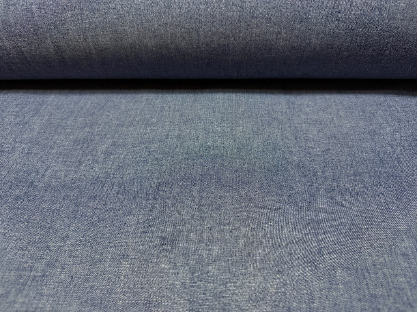 Okayama Denim 4.5 oz Japanese indigo selvage chambray fabric shown by the yard, lightweight and breathable.