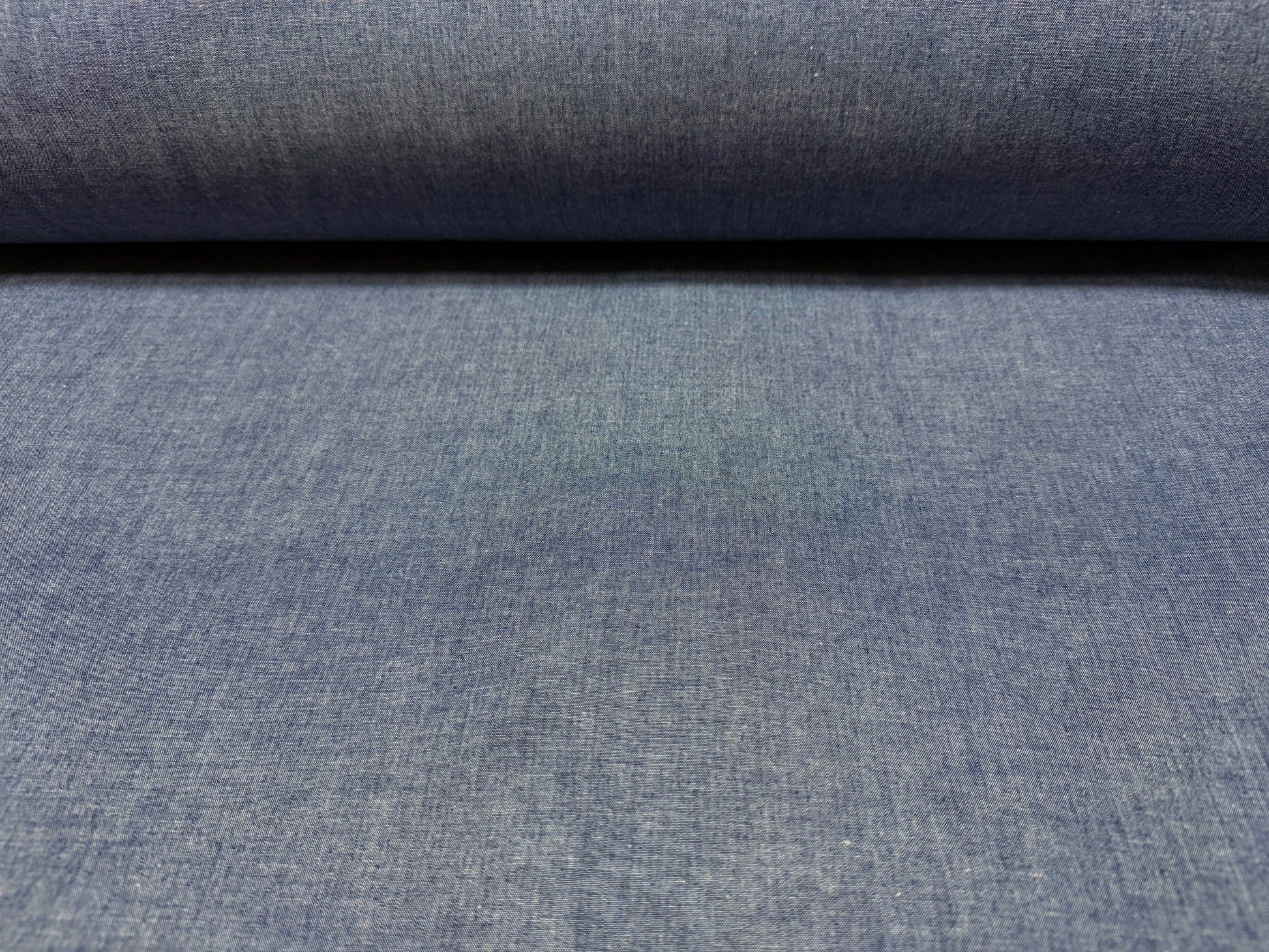 Okayama Denim 4.5 oz Japanese indigo selvage chambray fabric shown by the yard, lightweight and breathable.