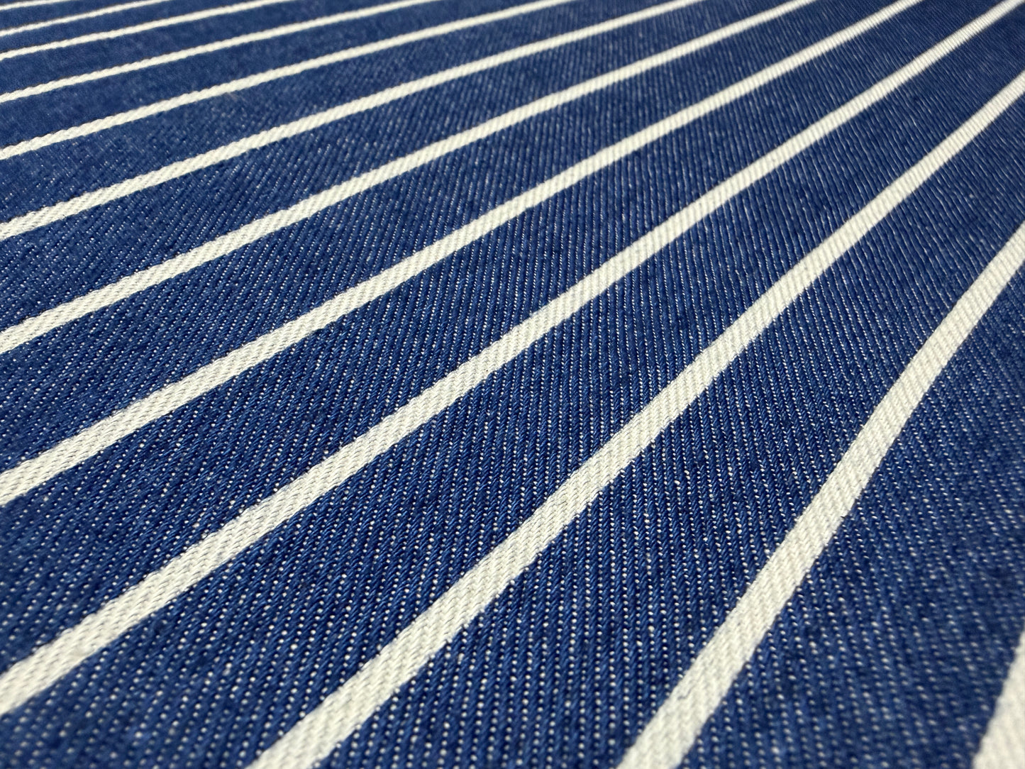Okayama Denim fabric featuring Japanese indigo cotton discharge printing stripes by the yard.