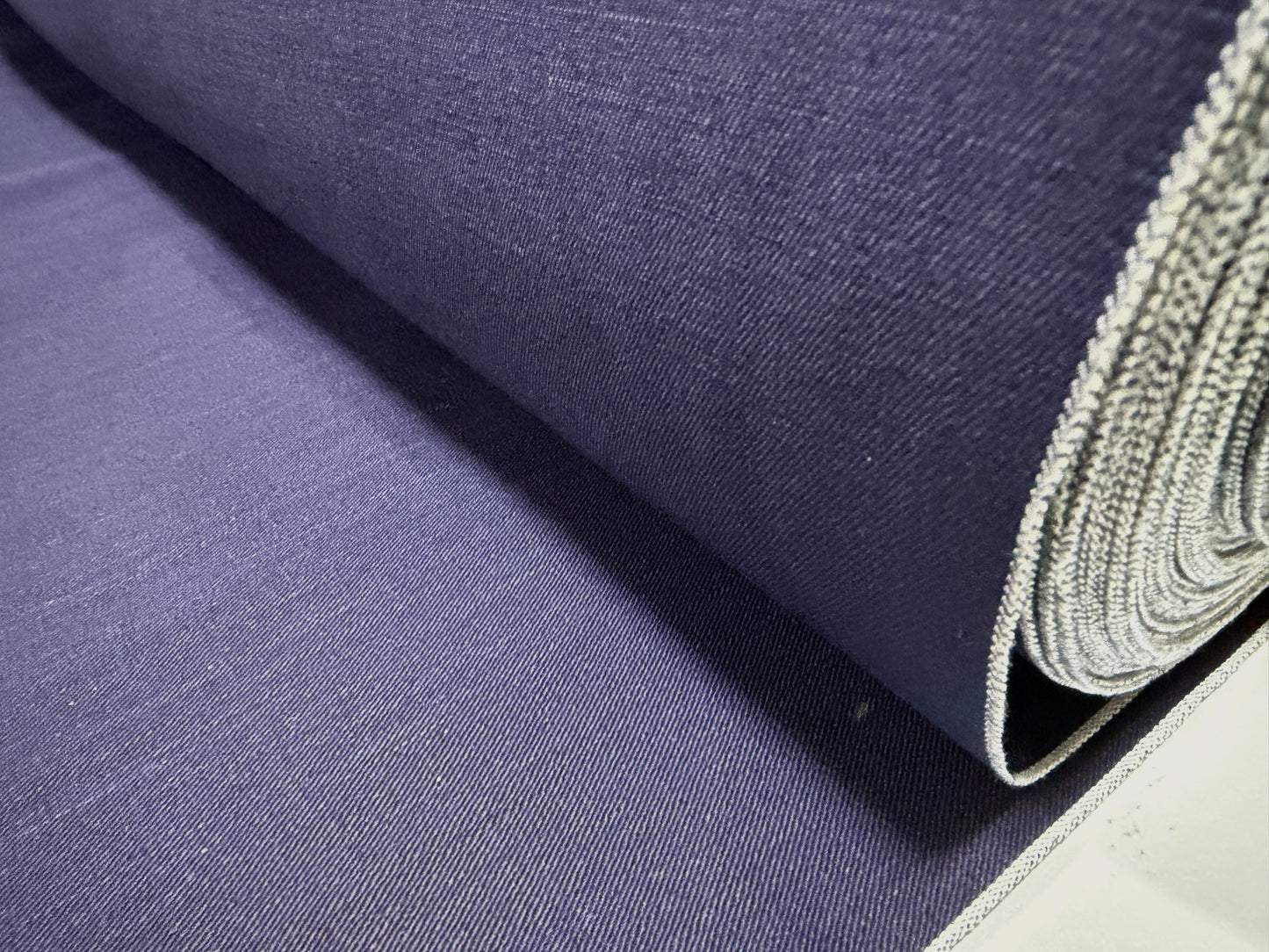 Close-up of Okayama Fabric, 6.5 oz double-sided indigo shirt-weight fabric for sewing.