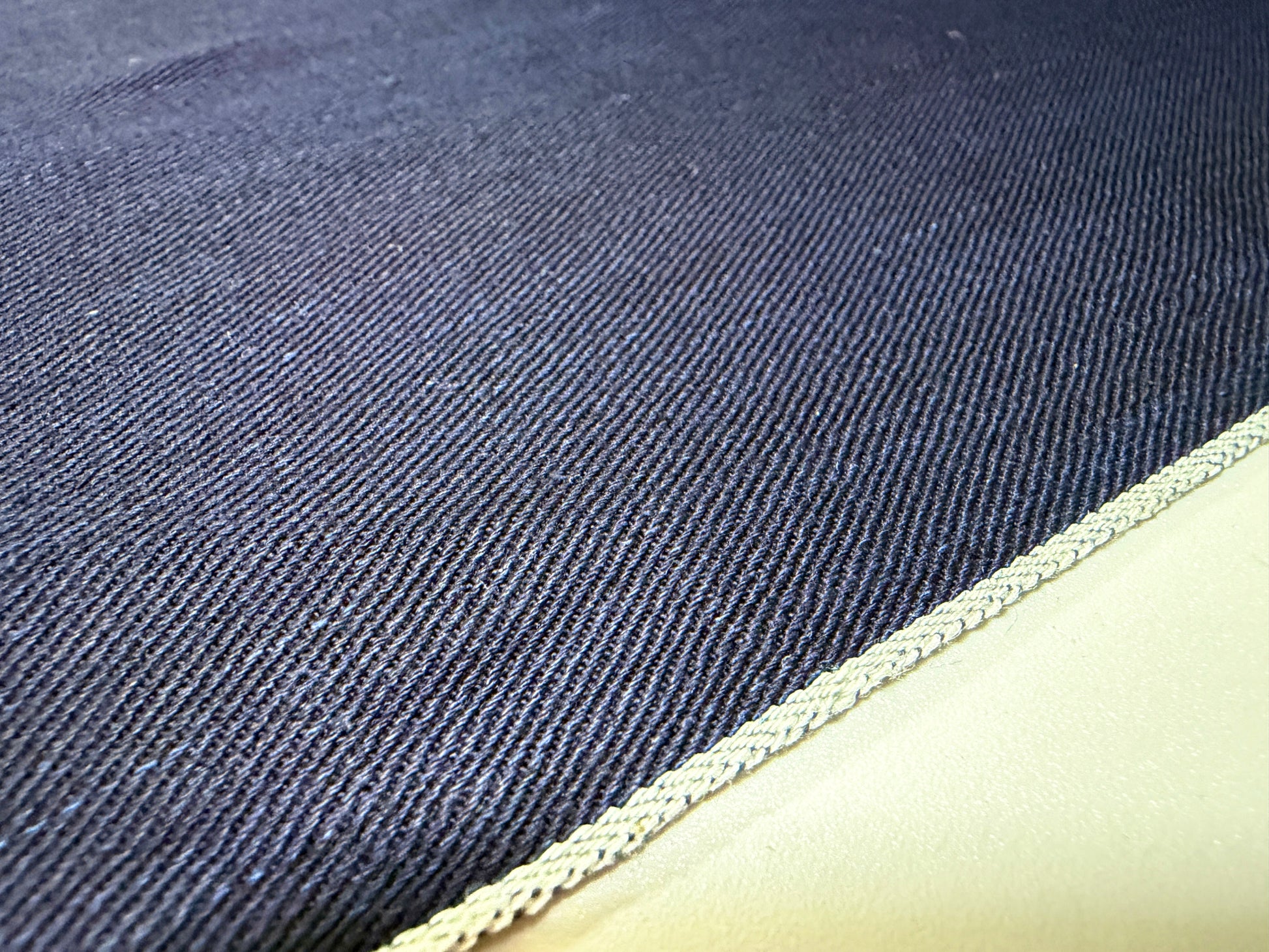 Okayama Denim 6.5 oz double-sided indigo shirt-weight fabric showcasing the selvedge edge.