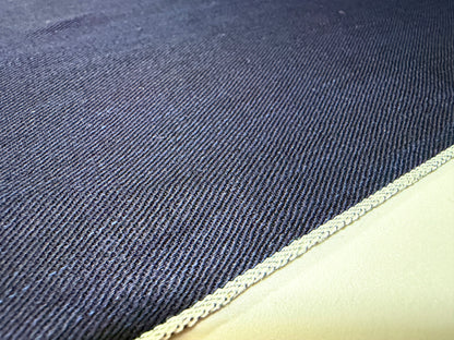Okayama Denim 6.5 oz double-sided indigo shirt-weight fabric showcasing the selvedge edge.