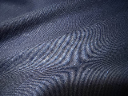 Close-up of Okayama Denim fabric, showcasing the soft texture of 6.5 oz double-sided indigo shirt-weight material.