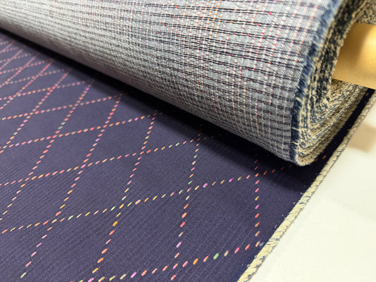 Okayama Denim 7 oz Sashiko fabric with colorful diamond stitching by the yard, showing unique design and texture.