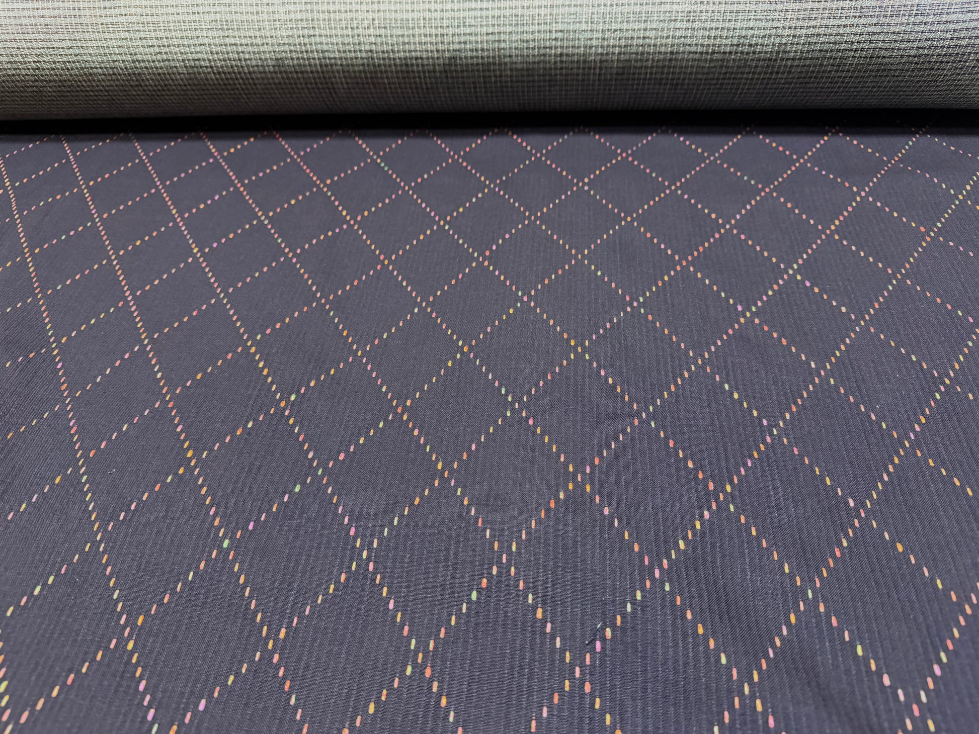 Okayama Denim 7 oz Sashiko fabric featuring colorful diamond stitching and a soft texture, ideal for unique projects.