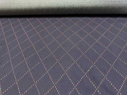 Okayama Denim 7 oz Sashiko fabric featuring colorful diamond stitching and a soft texture, ideal for unique projects.