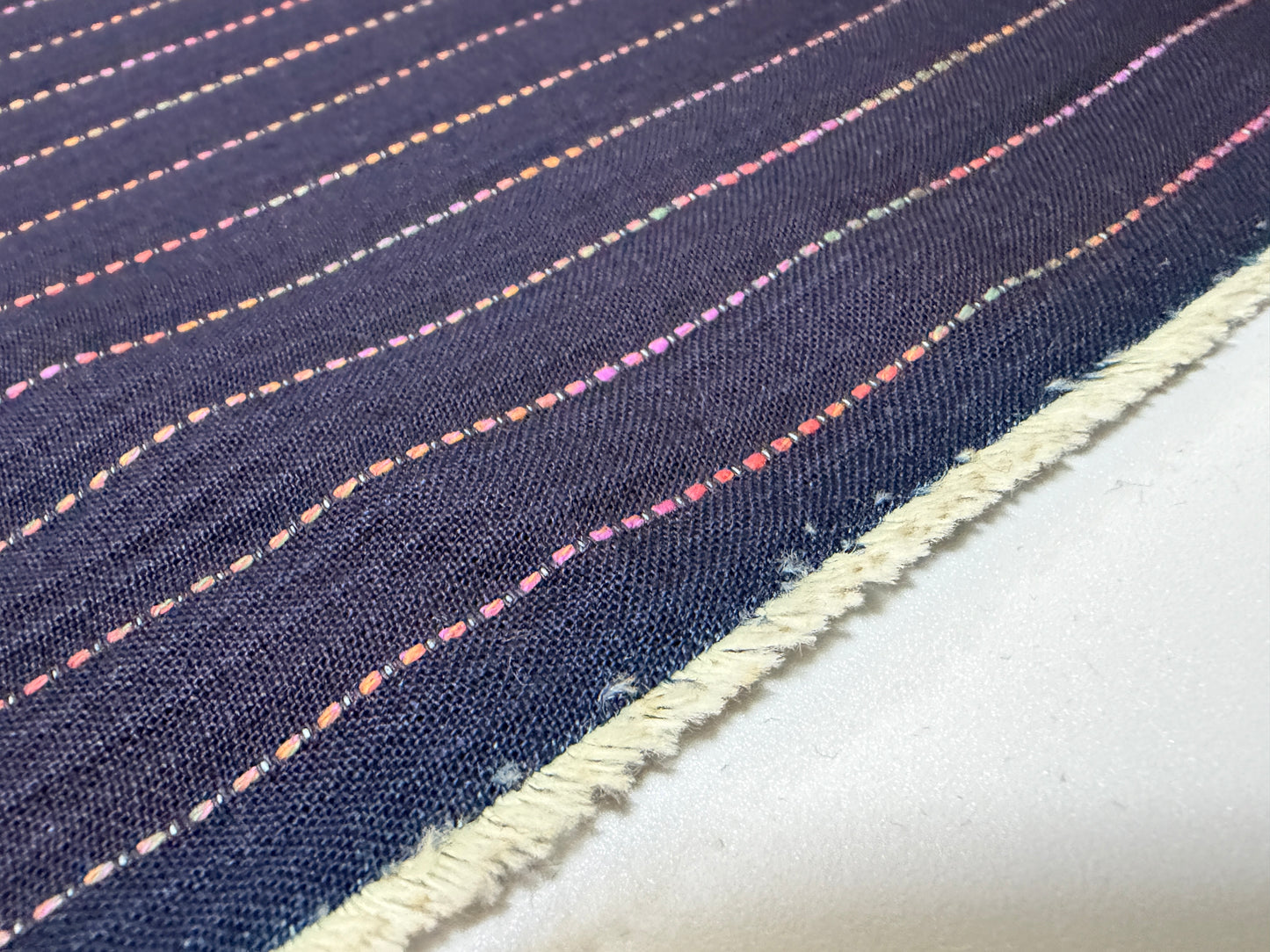 Okayama Denim 7 oz Sashiko fabric with colorful stitching, showcasing the unique stripes design by the yard.