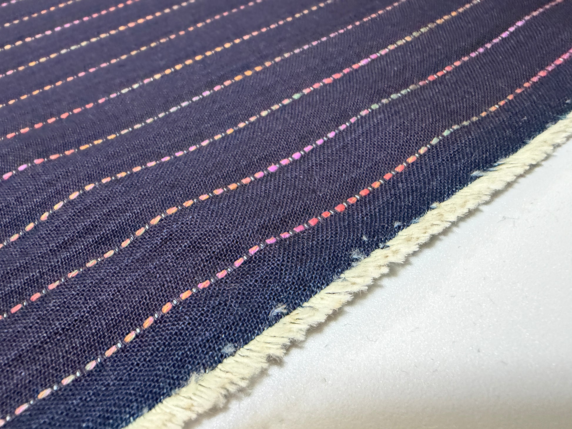 Okayama Denim 7 oz Sashiko fabric with colorful stitching, showcasing the unique stripes design by the yard.