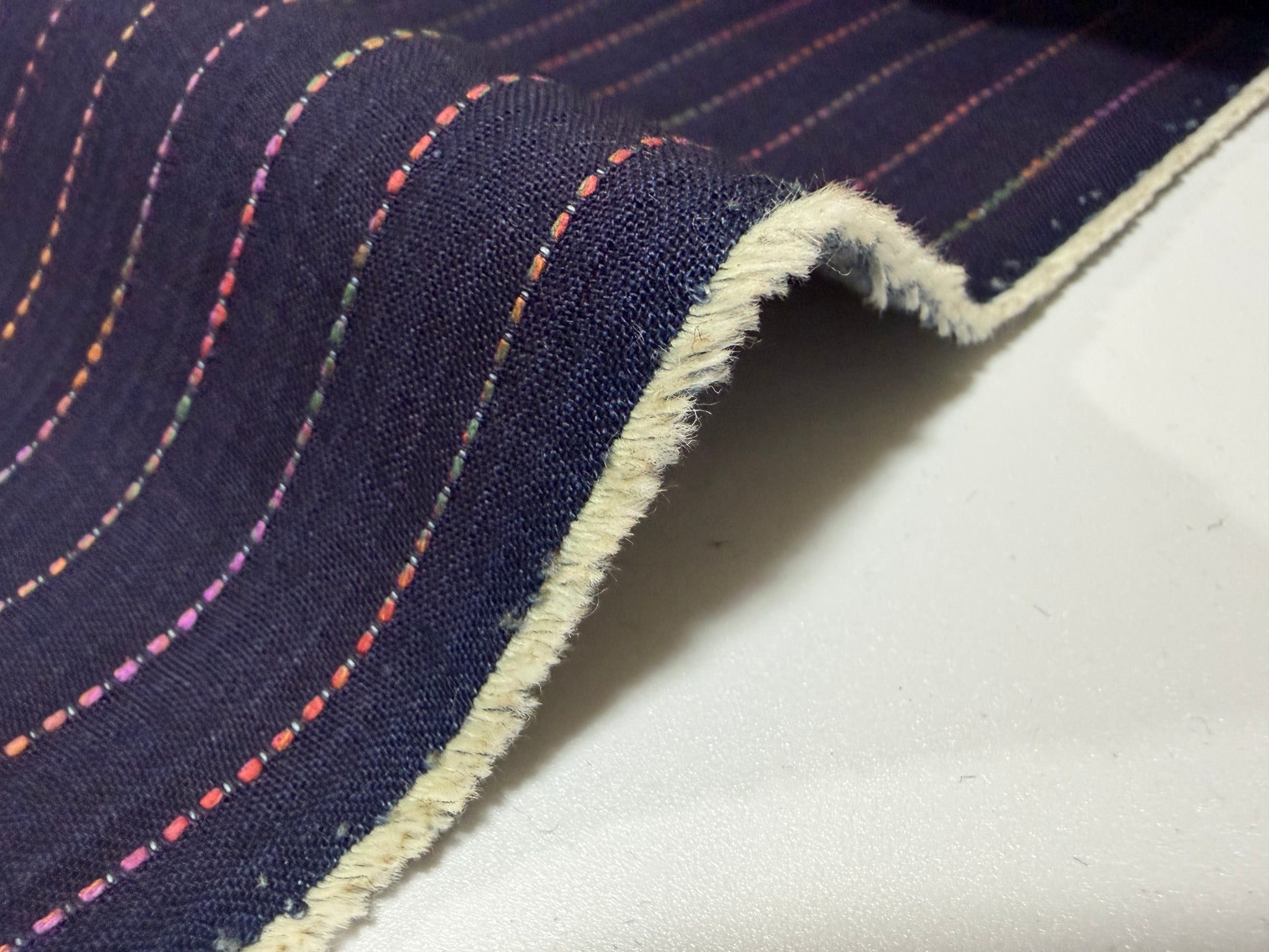 Okayama Denim 7 oz Sashiko stripes cotton fabric showcasing colorful stitching and soft texture.
