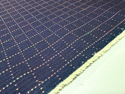 Okayama Denim 7 oz Sashiko "Grid" Cotton Fabric featuring colorful stitching design.