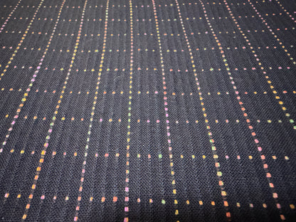Okayama Denim 7 oz Sashiko "Grid" Cotton Fabric featuring colorful stitching on a dark background.
