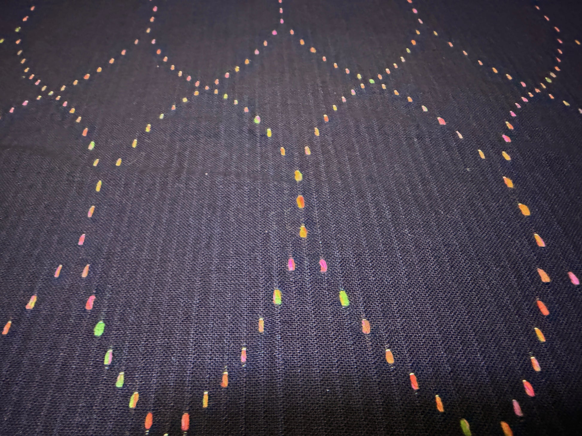 Okayama Denim 7 oz Sashiko 'Diamond Lattice' cotton fabric featuring colorful stitching detail.
