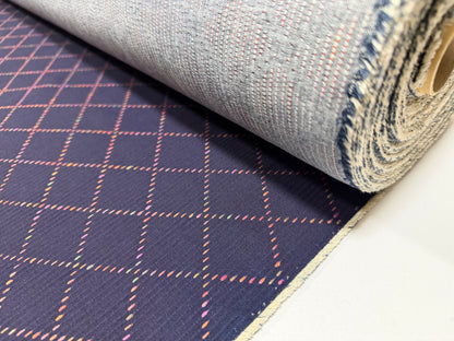 Okayama Denim 7 oz Sashiko fabric featuring colorful stitching and a unique small diamond pattern.