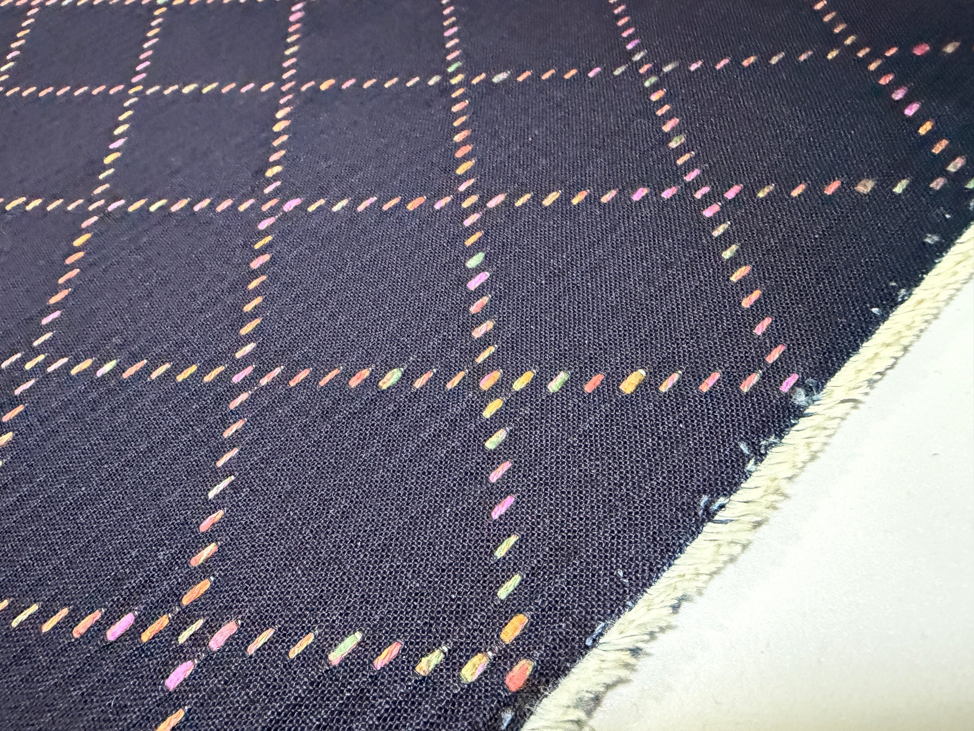 Okayama Denim fabric with colorful multi-color stitching in a unique 'Small Diamond' pattern, perfect for crafting.