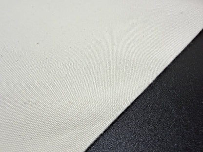 Close-up of Okayama Canvas, a 10 oz Japanese cotton ecru color fabric, ideal for bags and outerwear.