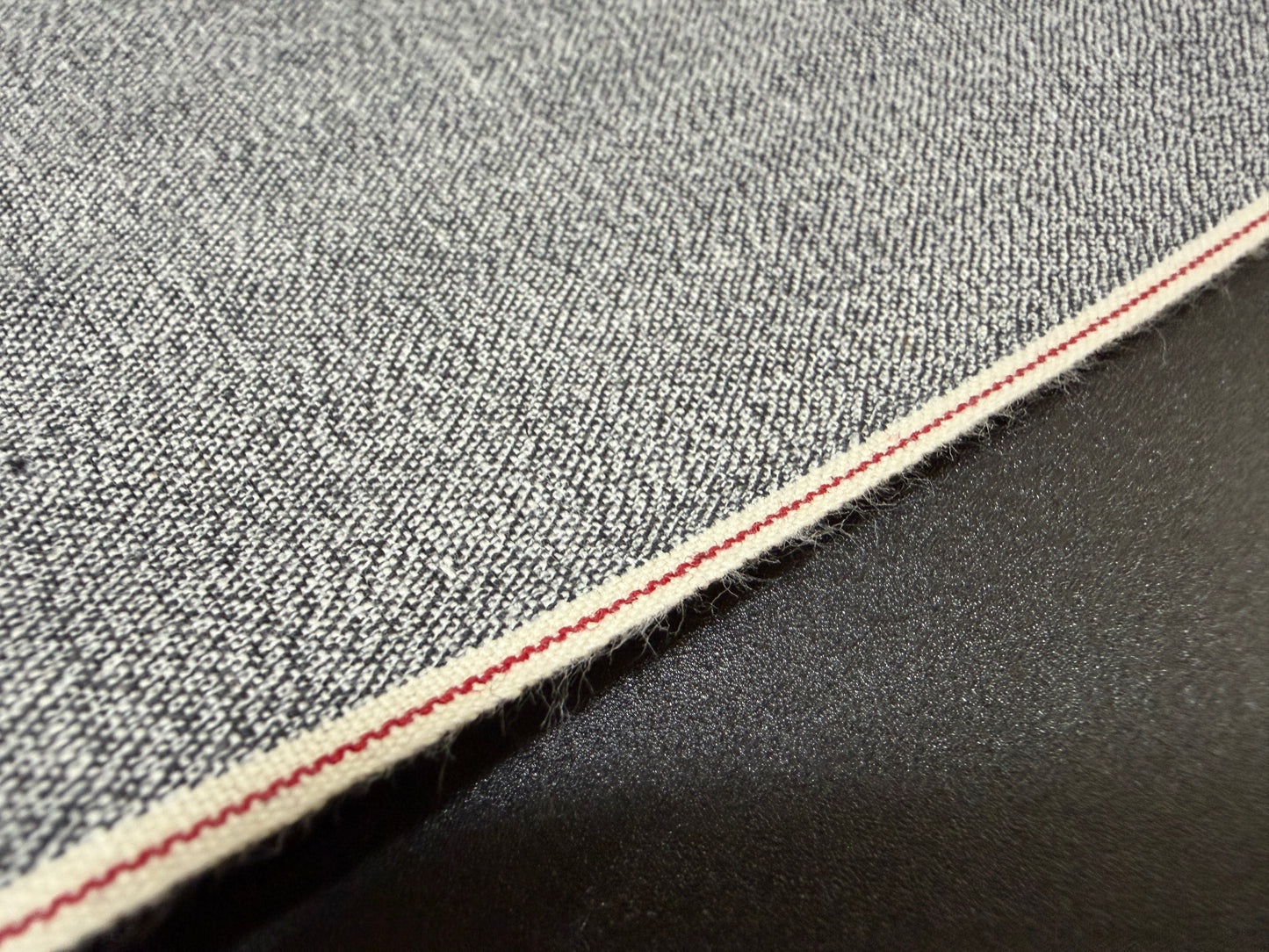 Okayama Denim 6 oz Japanese Gray Chambray fabric featuring red selvage by the yard.