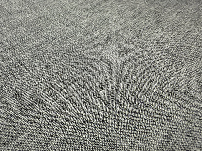 Okayama Denim 6 oz Japanese gray chambray fabric texture close-up on a flat surface.