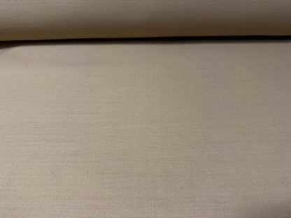 Okayama Denim 8 oz Japanese cotton beige dungaree fabric, showcasing a smooth and durable texture.