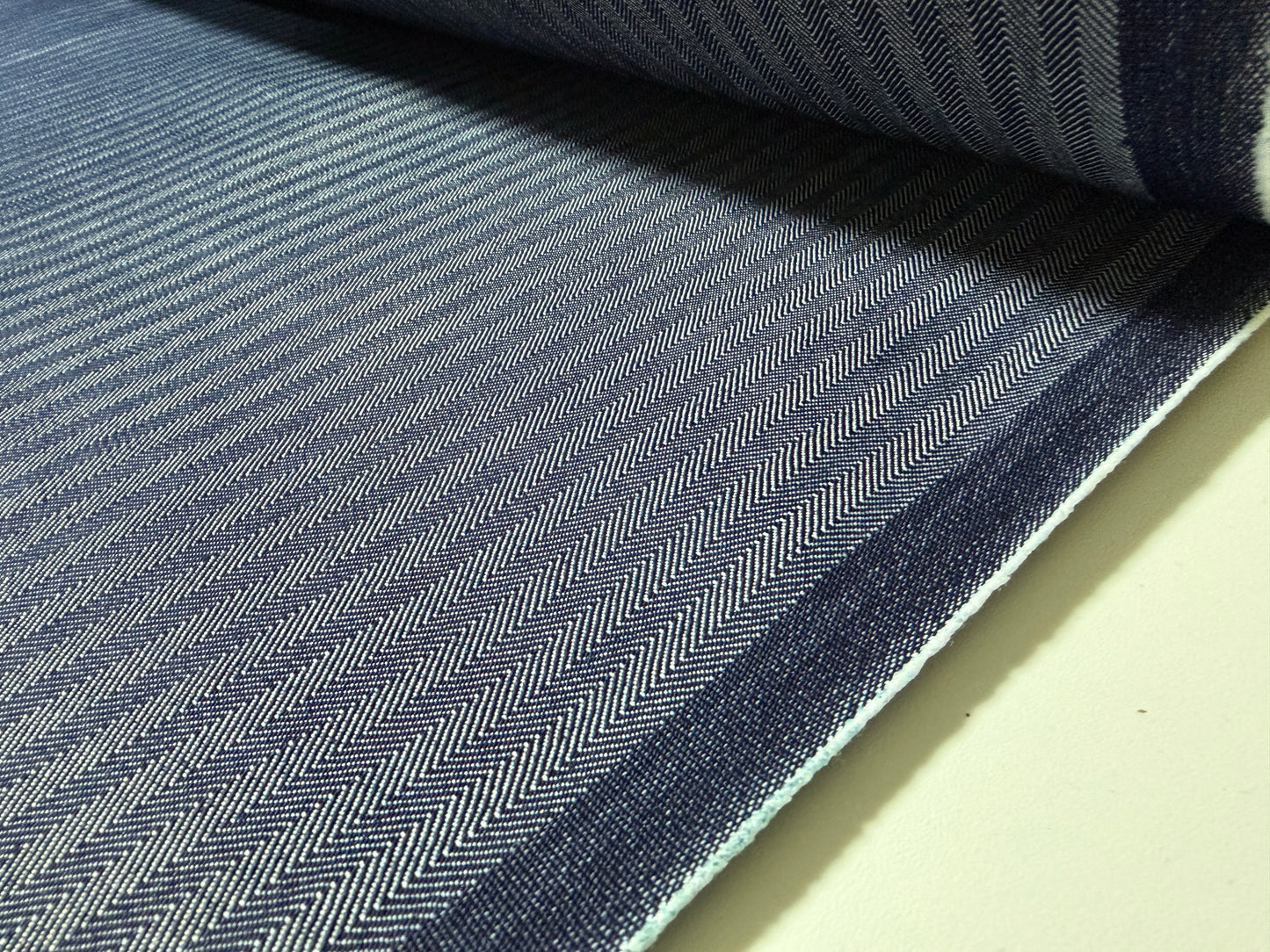 Okayama Denim fabric featuring a navy herringbone stripe pattern, made from high-quality Japanese cotton.