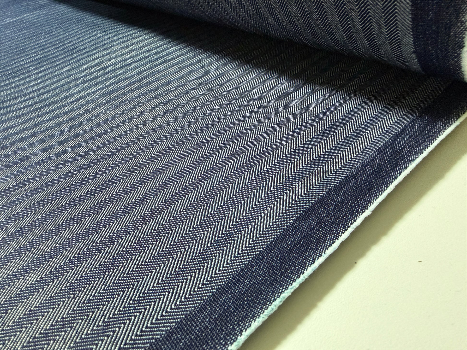 Okayama Denim fabric featuring a navy herringbone stripe pattern, made from high-quality Japanese cotton.